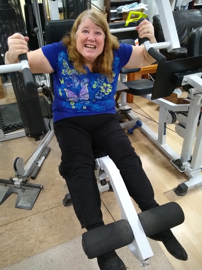 Lois on the exercise machine. How many weights did you put on here Don?