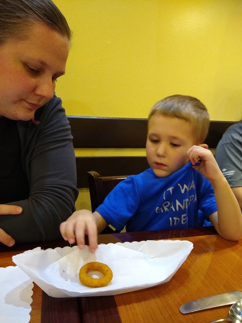 Stacia and Austin consider an onion ring.
