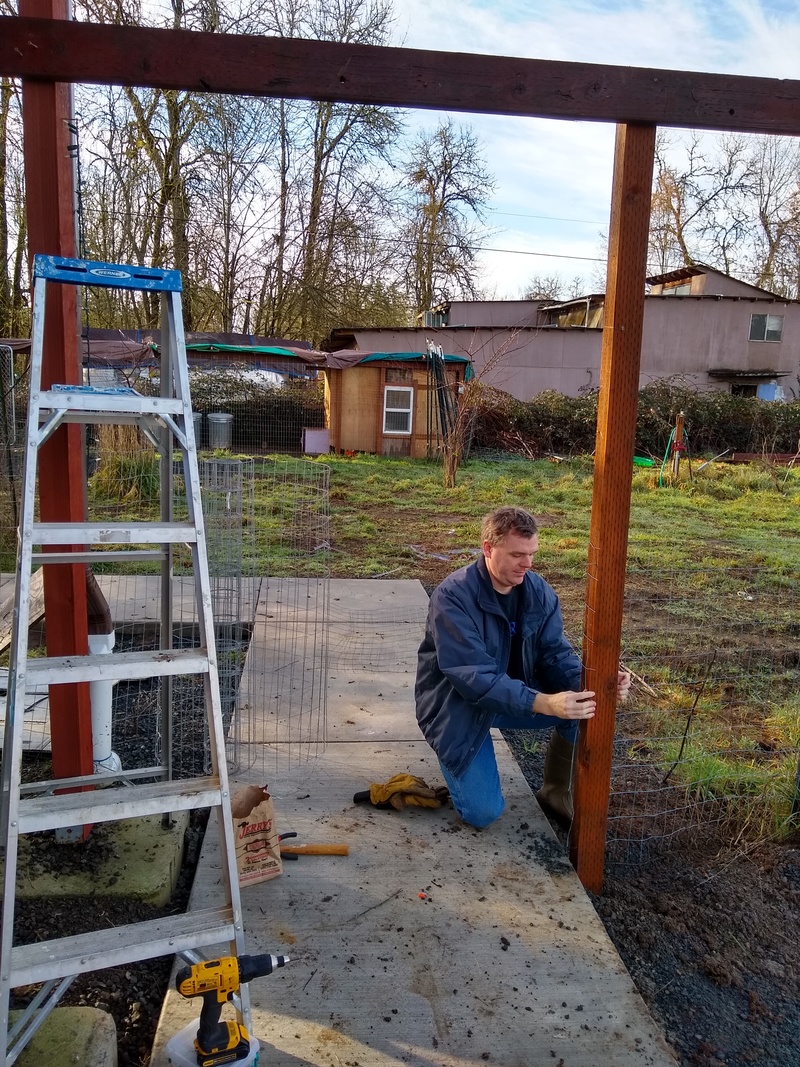 Joseph sets the west post for the new gate we are building.