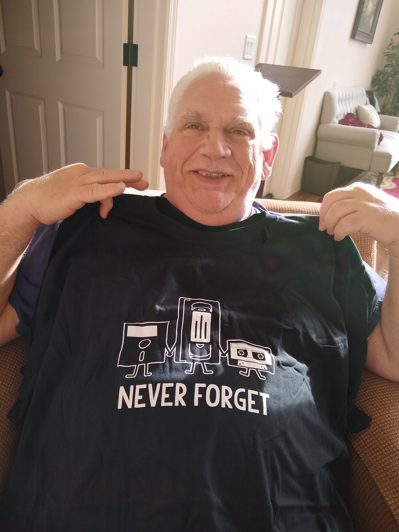 Don's Birthday Present. A shirt from Stacia that says "Never Forget" and features a floppy disk, a VHS tape, and a cassette tape.
