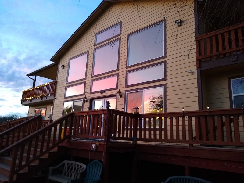 Beautiful sunset reflected in the great south windows of Rosewold.