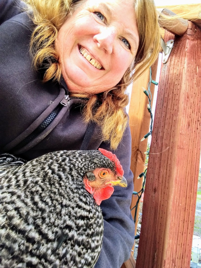 Lois is still the crazy chicken lady. Dominique is very willing for people to hold her.