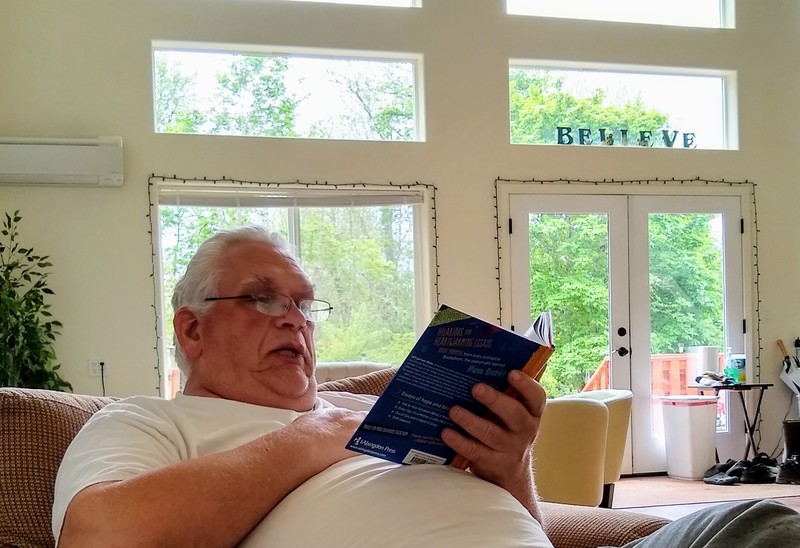 Don reads to Lois. We are reading "Mom Babble" to each other by Mary Katherine Backstrom.