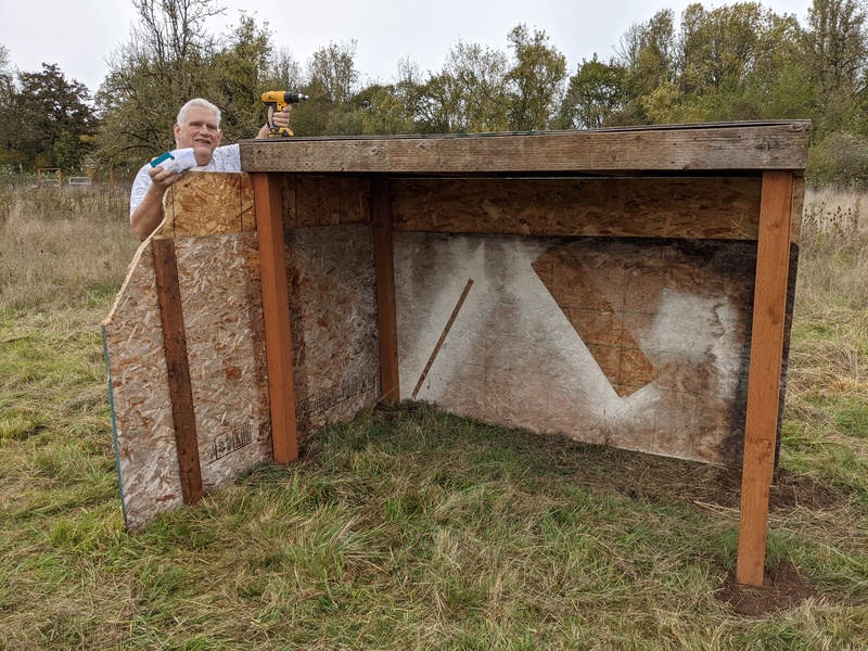 Don is showing off the new sheep shelter in the middle pasture.