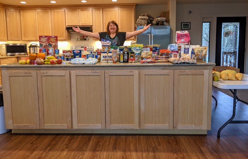 Lois with our holiday food stockpile.