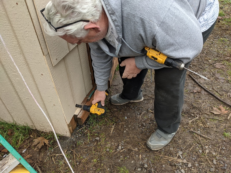 Don drills a one-inch hole.