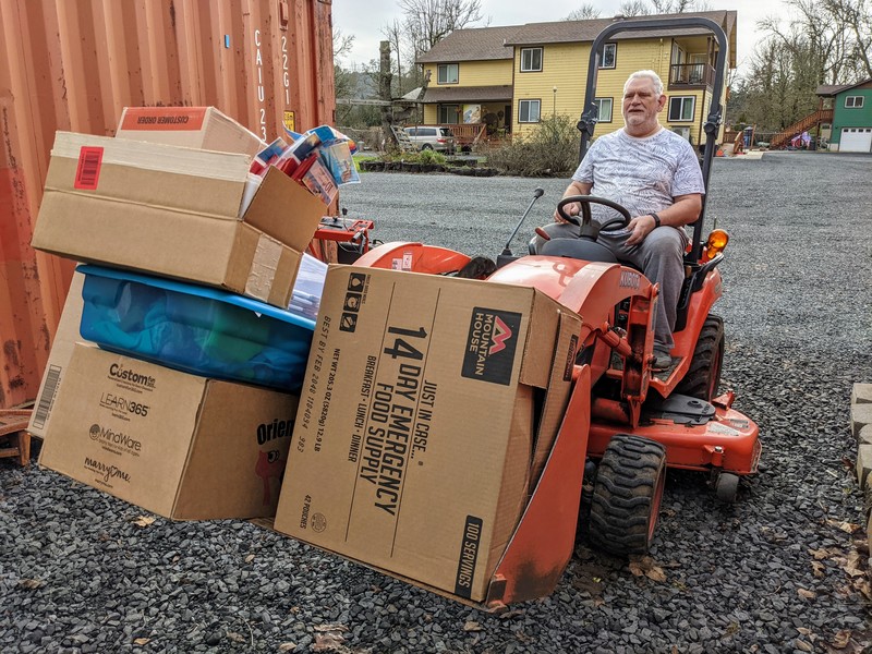 Don hauls the boxes that Lois brought out of ACon.