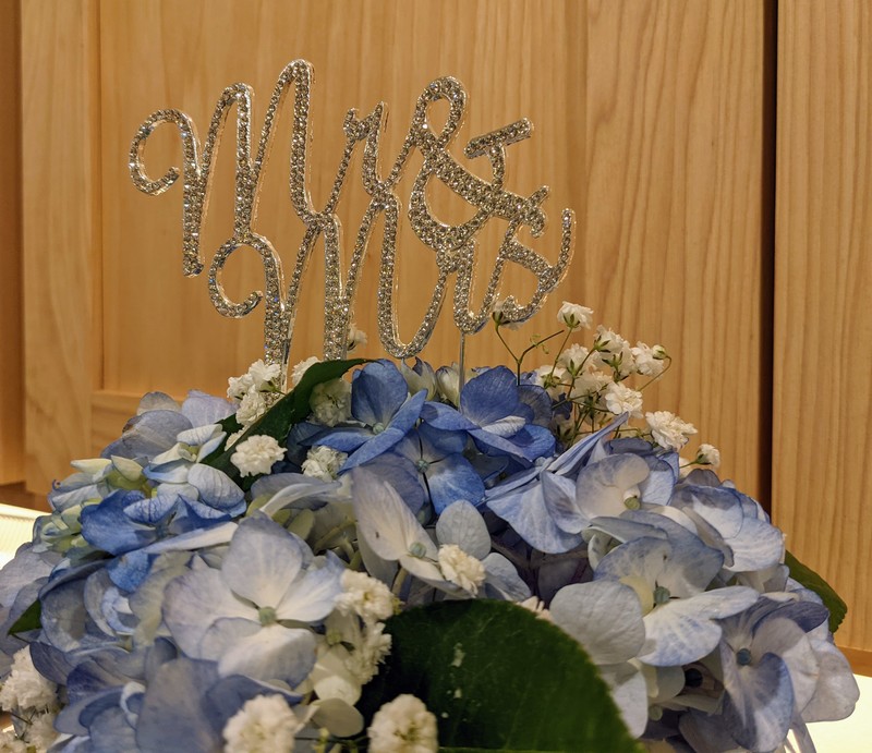 The cake topper and hydrangeas.