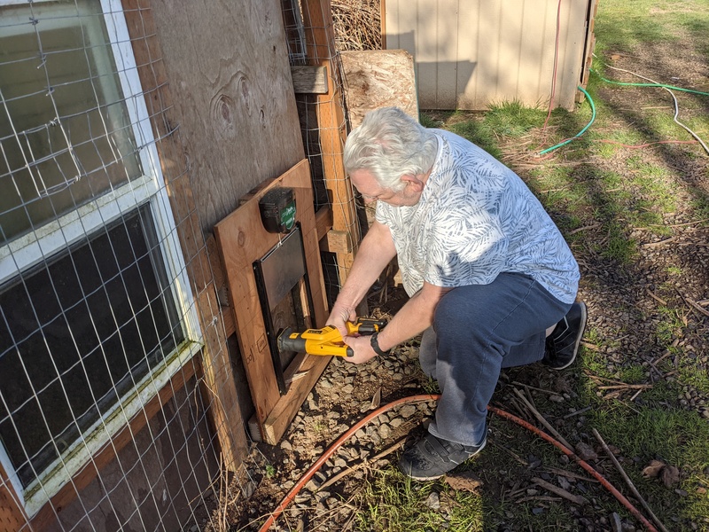 Don cutting the hole for the door.