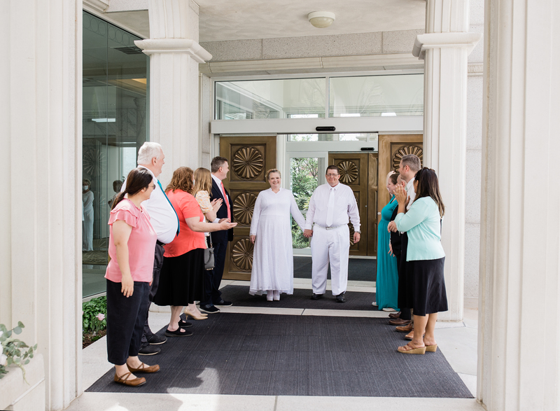 Larissa and Benjamin coming out the door of the temple.