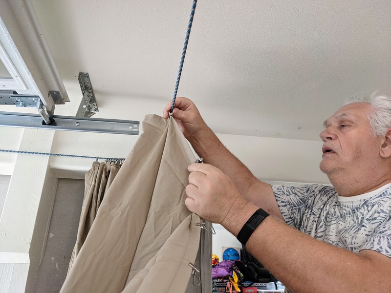 Don hanging curtains in the garage for some privacy.
