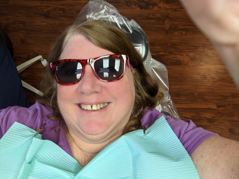 Lois sports glamour shades st the dental office.