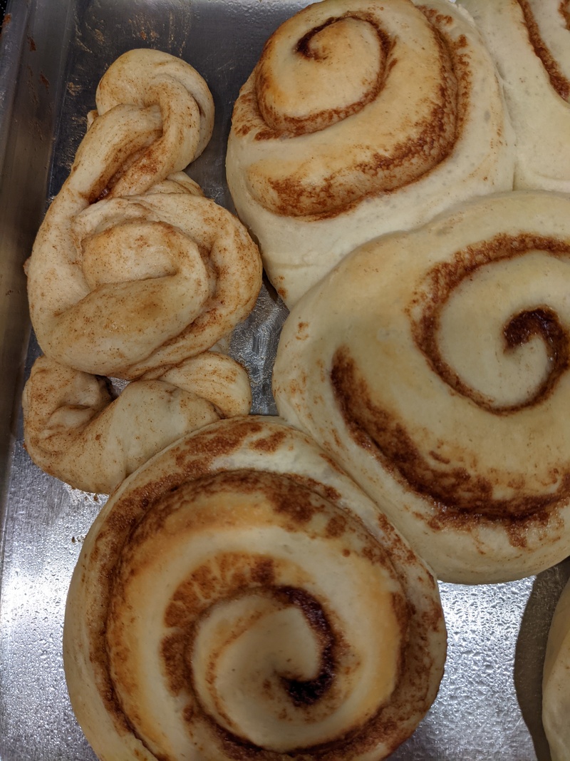 Lois practiced making cinnamon rolls in a the clef shape.