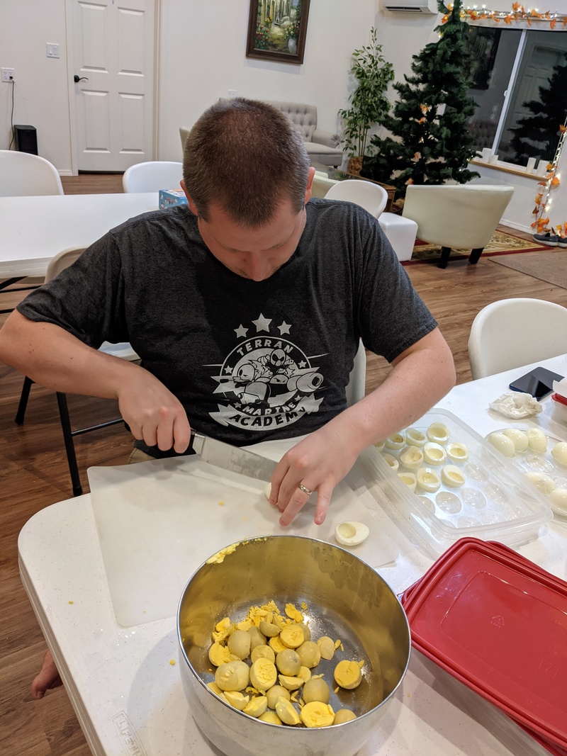 Isaac making deviled eggs.