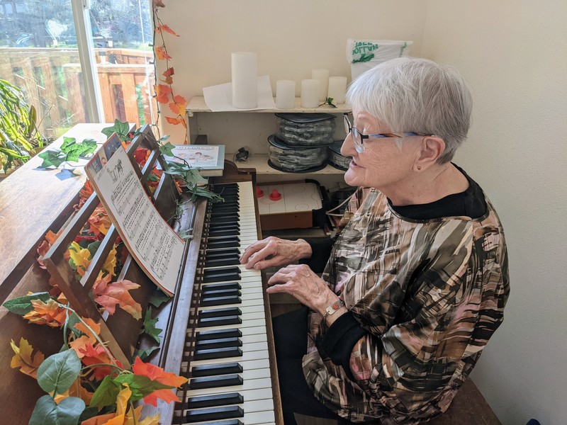 Aliene playing the piano.