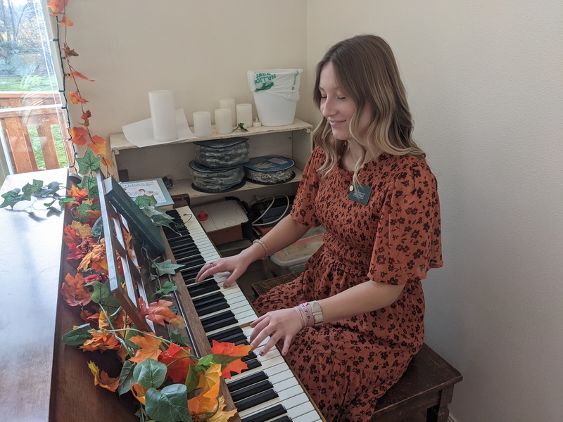 Sister Hill playing the piano.