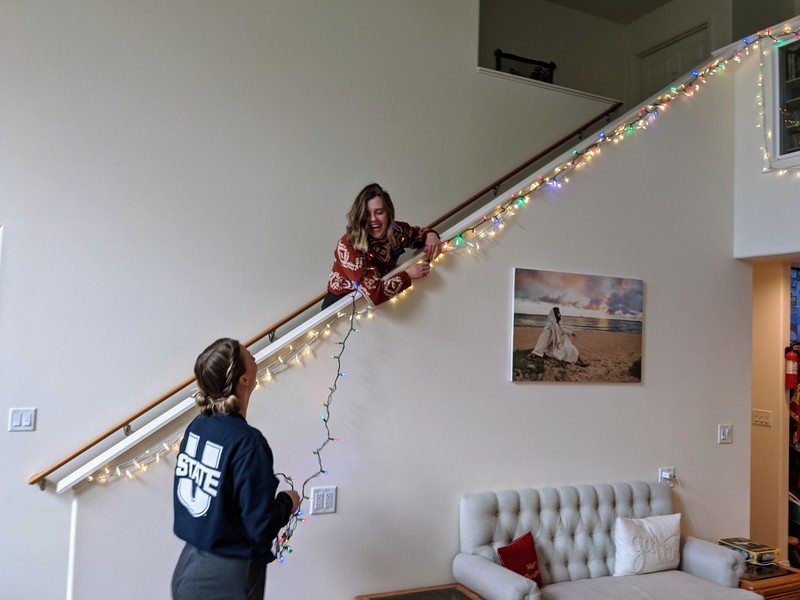 Sister Hill and Sister Earl putting up lights.