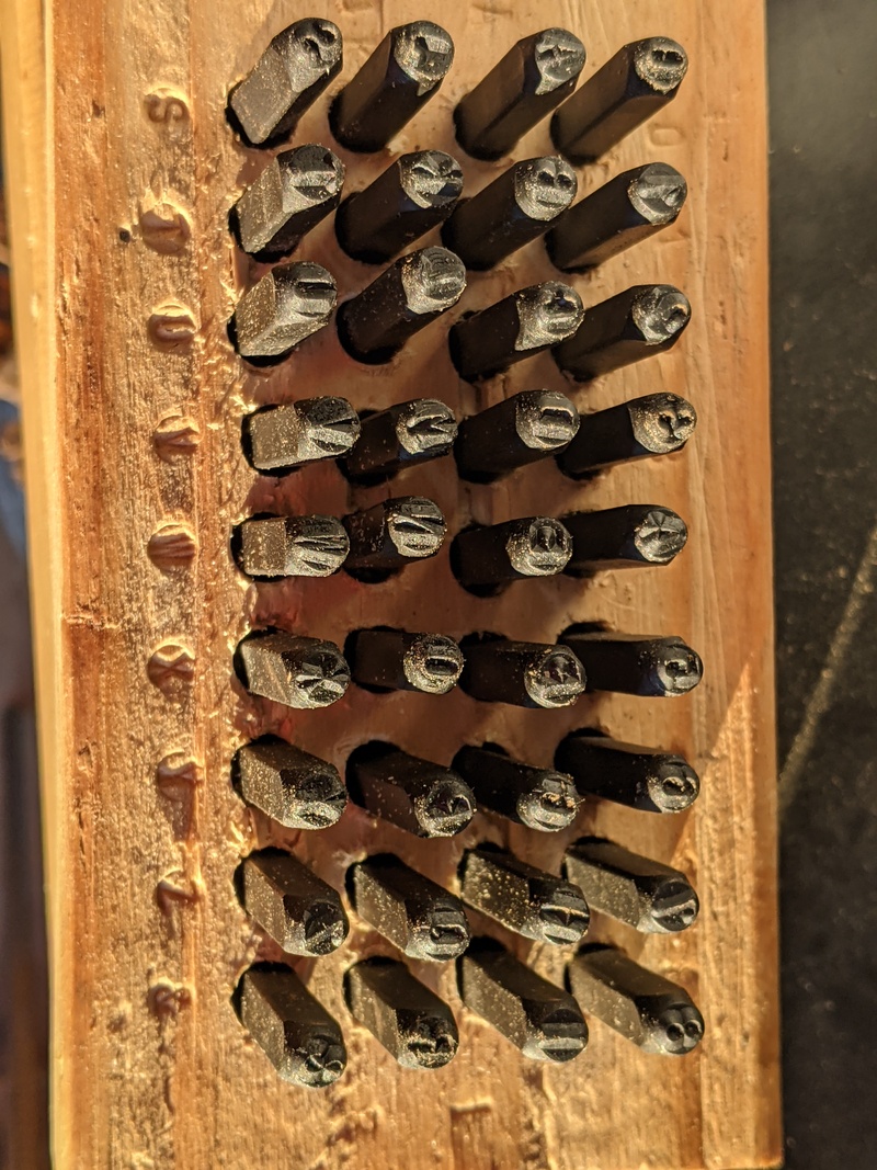 Don got a 36pc set of 1/8-inch letter punches. He drilled a piece of 2x4 to organize the punches.
