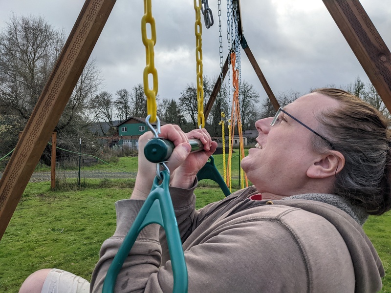 Ben doing chin ups on the trapeze bar.