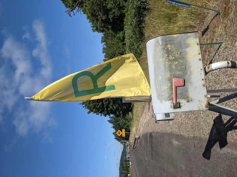 Rosewold Feather Flag at Mailbox. Seen from the Crater Lake side. Turn right, before the mailboxes.