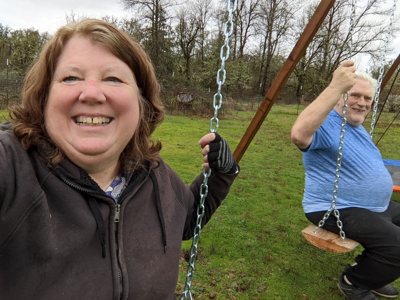 Two kids having fun on the newly installed adult plank swings....hum.. Are they adult enough?