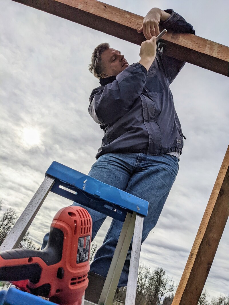 Joseph working on the platform swing hangers.