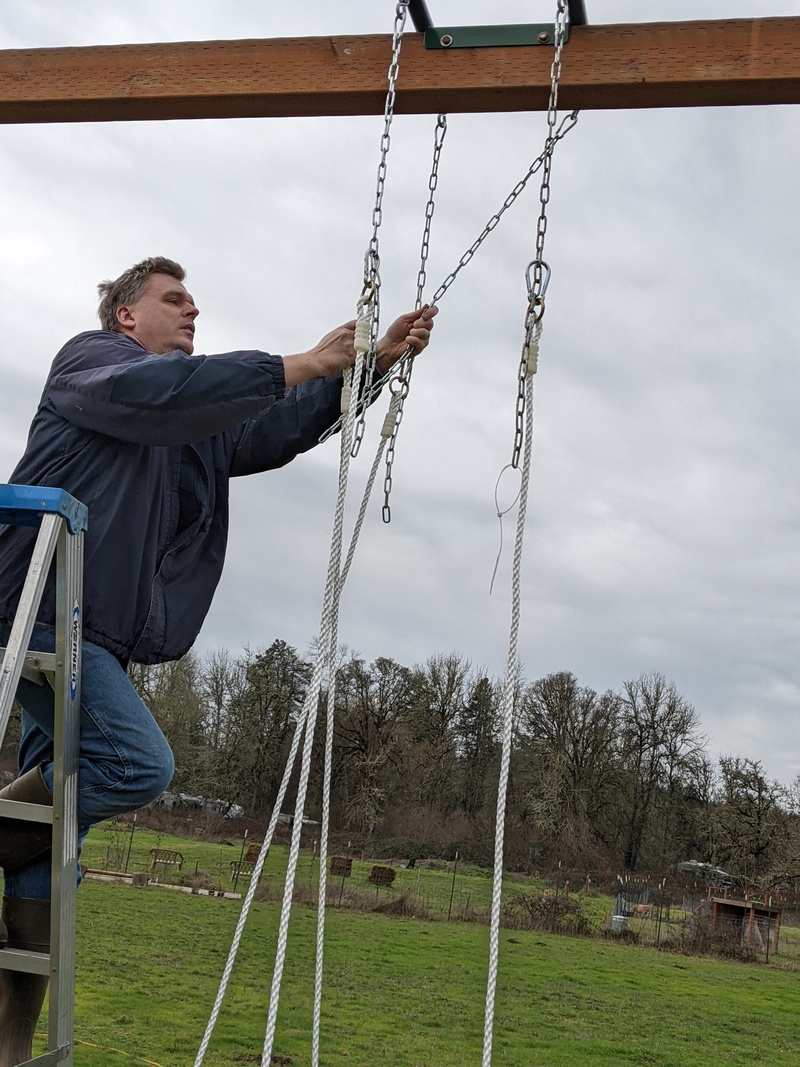 Joseph hanging up the face to face glider.