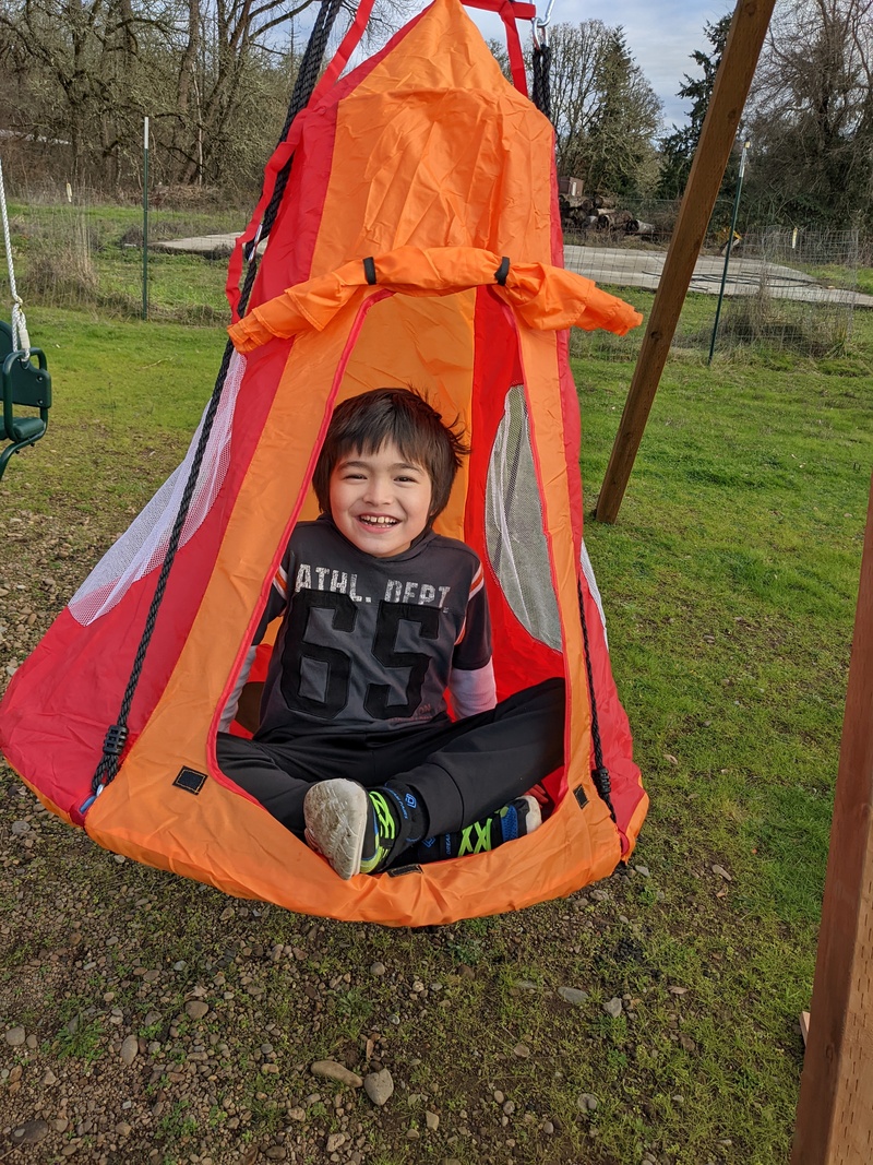 Kekoa inside the tent swing.