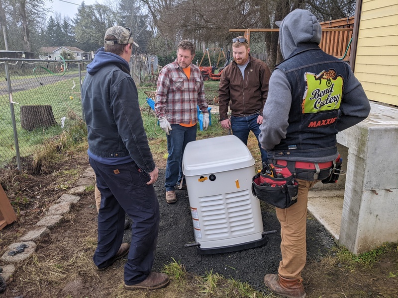 The crew gets ready to lift the new 24kW into place.