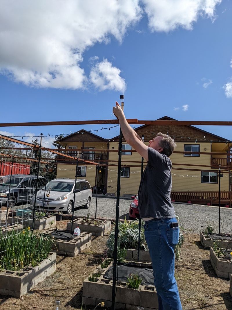 Joseph taking off the end caps of the waffle drop to flush out any debris.