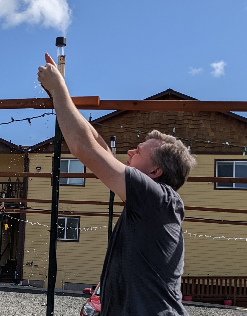 Joseph taking off the end caps of the waffle drop to flush out any debris.