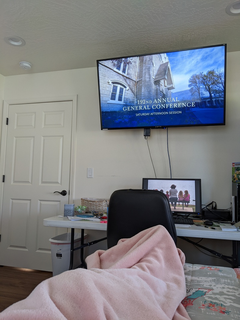 Lois watching conference in room 1.