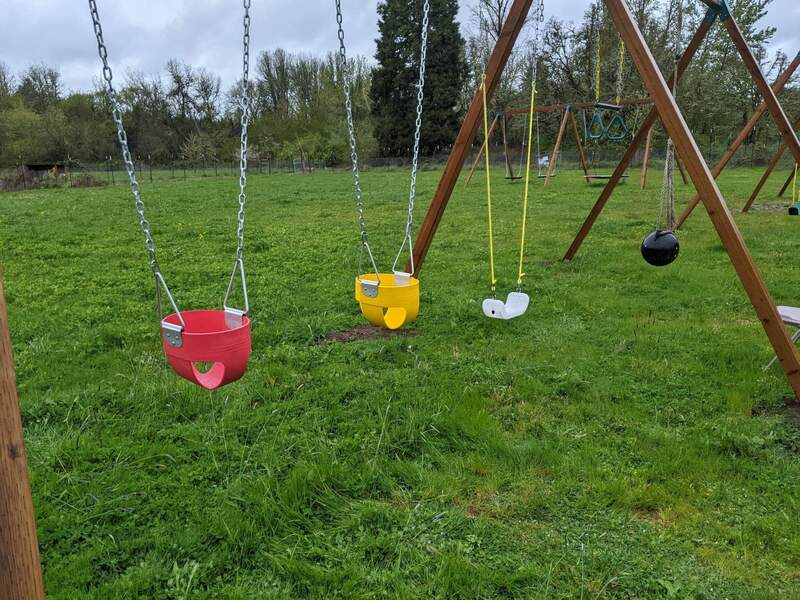 The red and yellow swings are industrial grade and were added by Ben and Zing Zing.