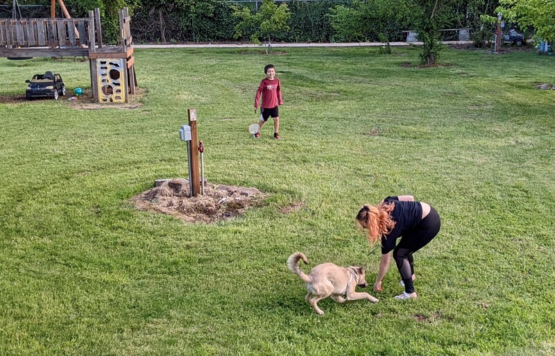 Kekoa and Shannon playing badminton.