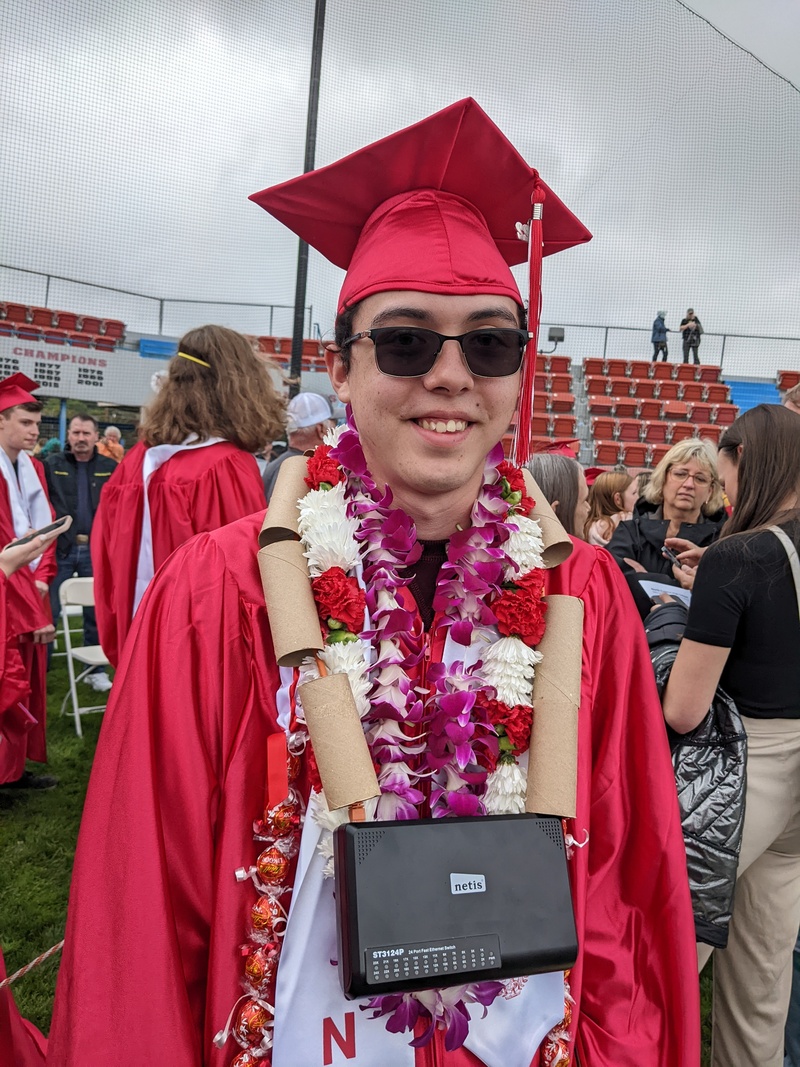 Mikey with Lei. It is a (defunct) gigabit switch hanging on a cat6 patch cable.