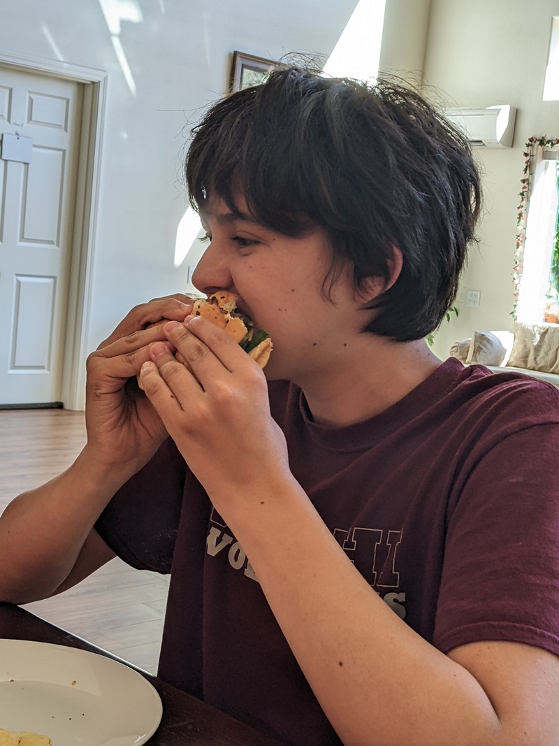 Alex eating 4th of July Burger.