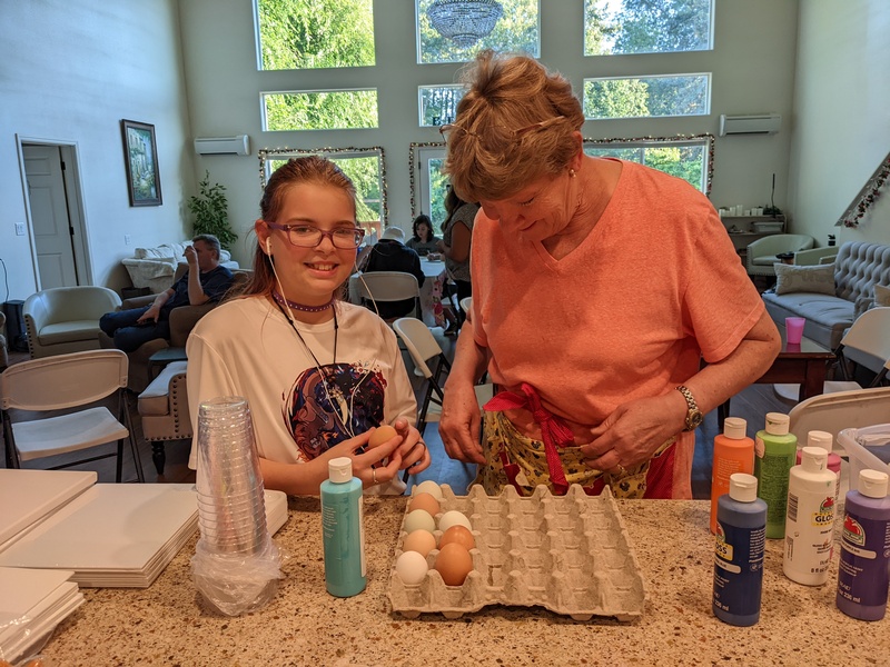 Cassie and Laura bringing in the daily eggs.