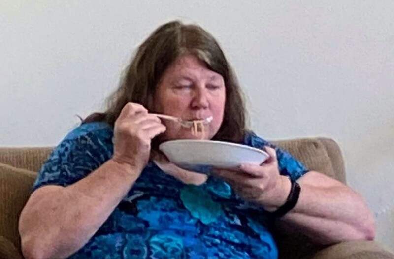 Lois feeding her face with spaghetti