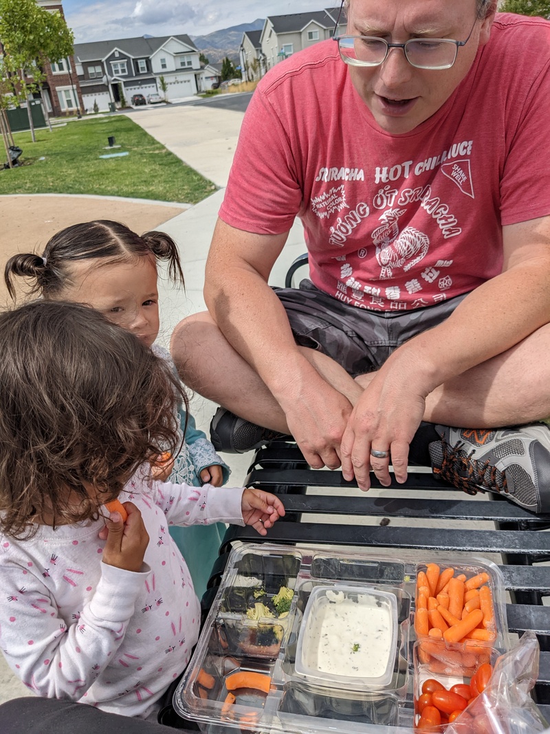 Snack time, except one can't eat carrots, and the other just wanted to bite them.