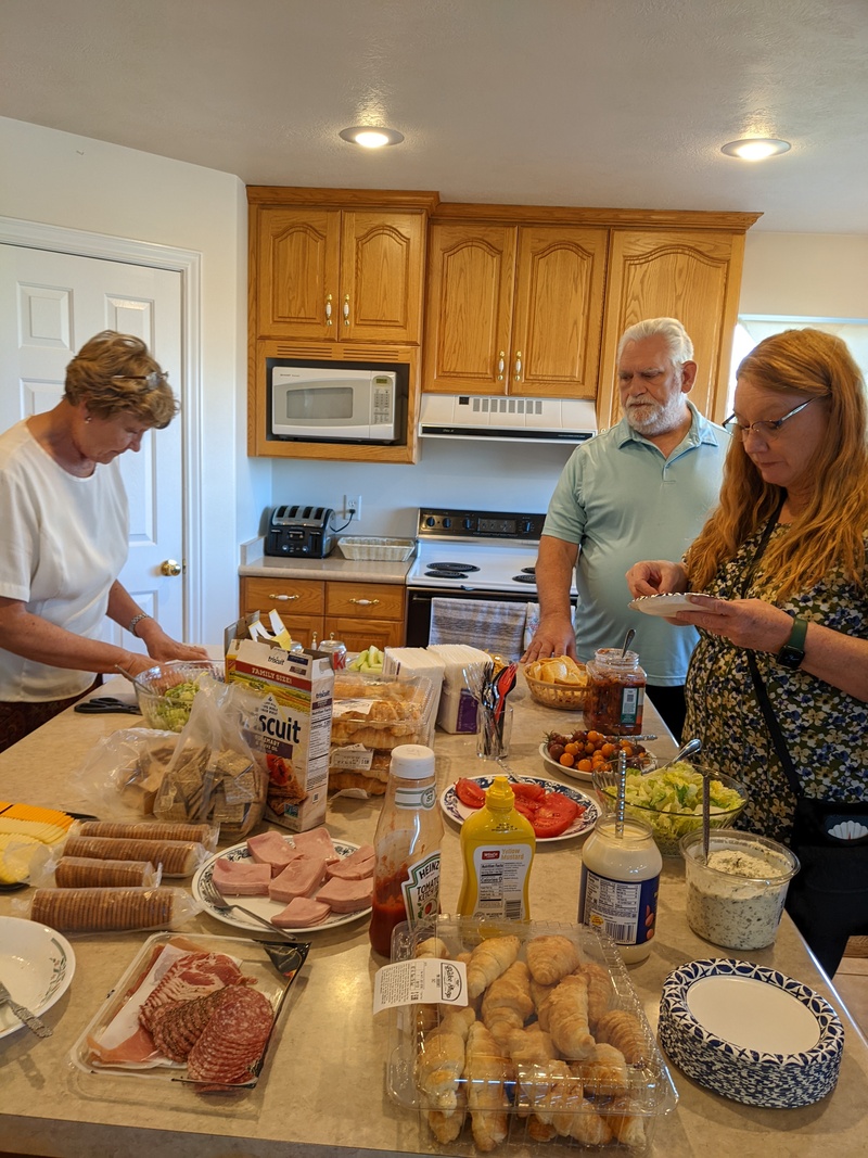 Laura, Don, Diana. Food table