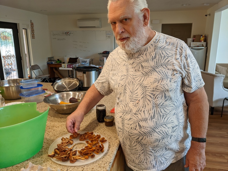 Don tasting the dried fruit.