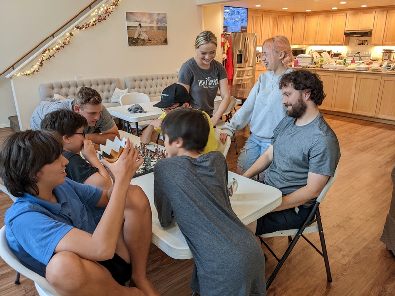 Joseph's family playing chess.