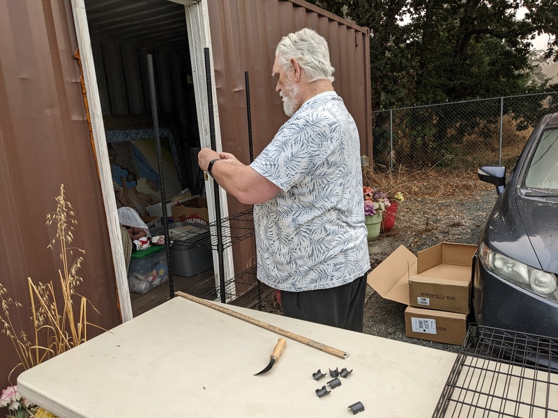 Don building a shelving unit for LoCon.