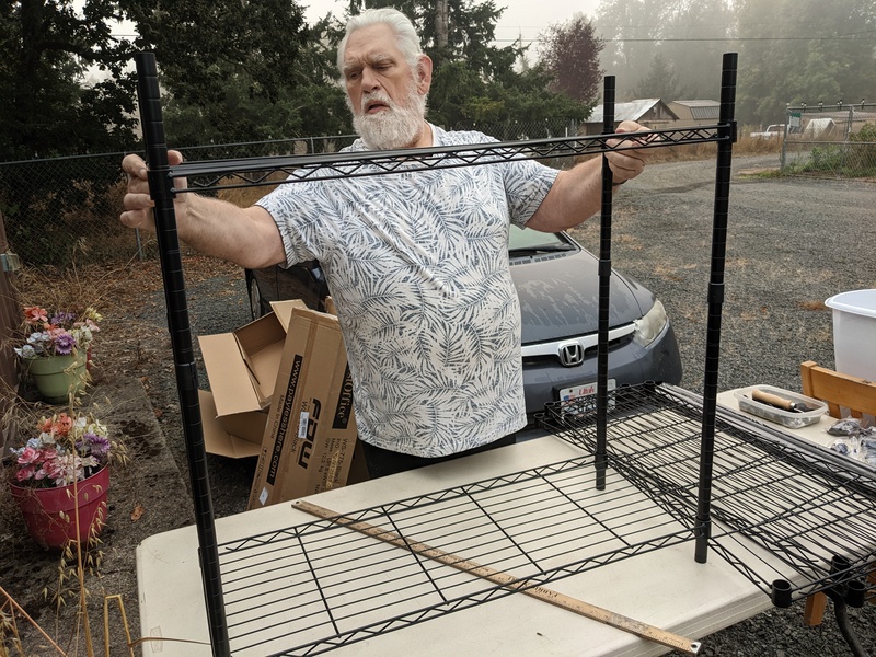 Don building a shelving unit for LoCon.