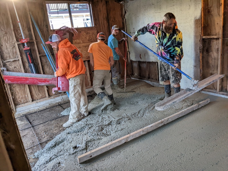 guys pouring cement