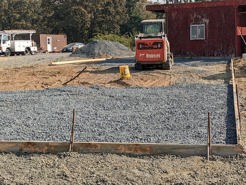 Gravel is being placed on the framed in area.