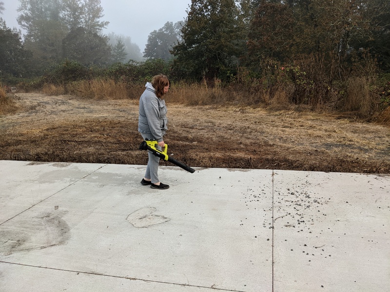 Lois cleaning off the north village cement pad.