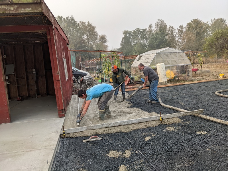 Pouring concrete and leveling.