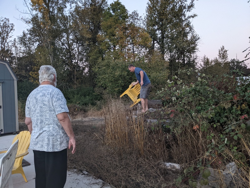 James retrieves our chair out of the blackberry Vines.