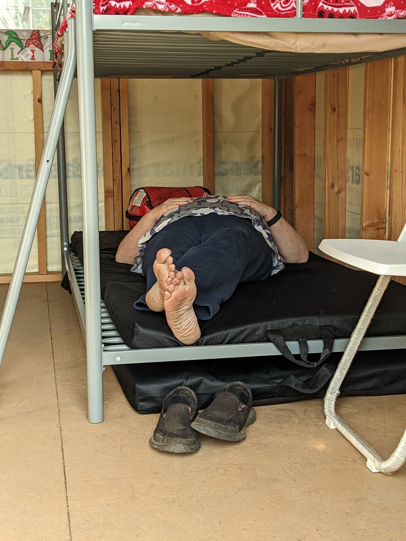 Lois trying out the bunkbed. She decided the second mattress can go on top of this first one.